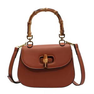 OEM Nuevo bolso de cuero de primavera y verano Bolso de hombro para mujeres de alta calidad Diseño de nicho de nicho de lujo mini bolsillo de silla de montar